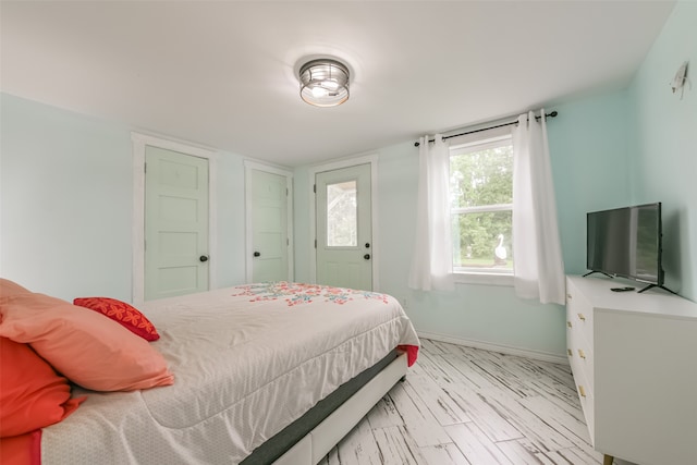 bedroom with wood-type flooring