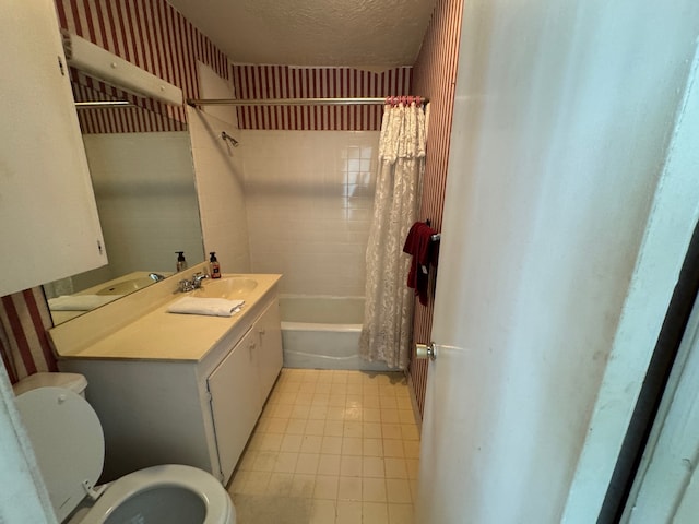 full bathroom featuring shower / tub combo, toilet, tile flooring, a textured ceiling, and vanity