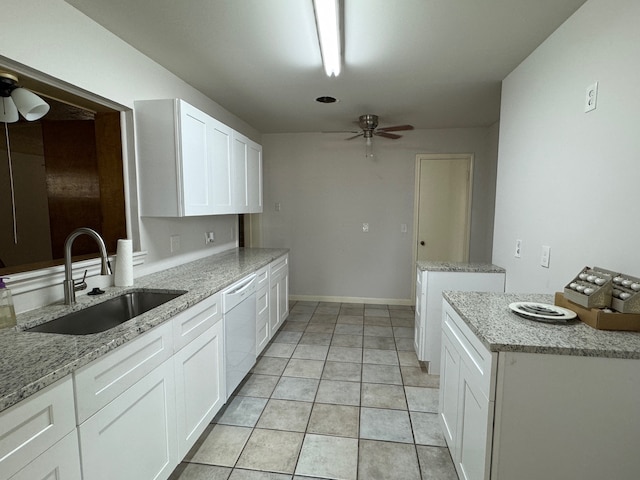 kitchen featuring white cabinets, sink, light tile floors, dishwasher, and ceiling fan