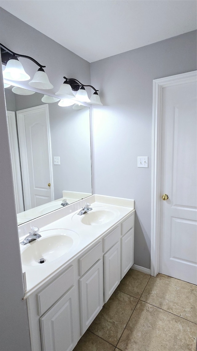 bathroom with tile patterned flooring and vanity