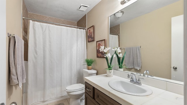 bathroom featuring vanity, toilet, tile patterned floors, and walk in shower