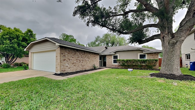 single story home with a front yard and a garage