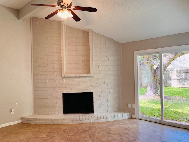 unfurnished living room with a healthy amount of sunlight, vaulted ceiling, ceiling fan, and light tile floors