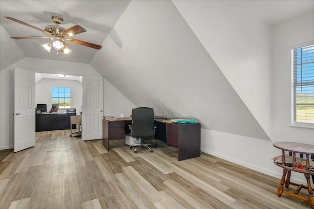 office area featuring light hardwood / wood-style floors, ceiling fan, and vaulted ceiling