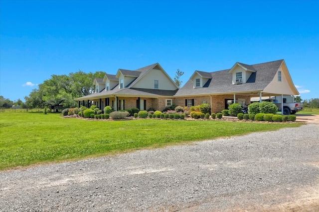 cape cod-style house featuring a front yard