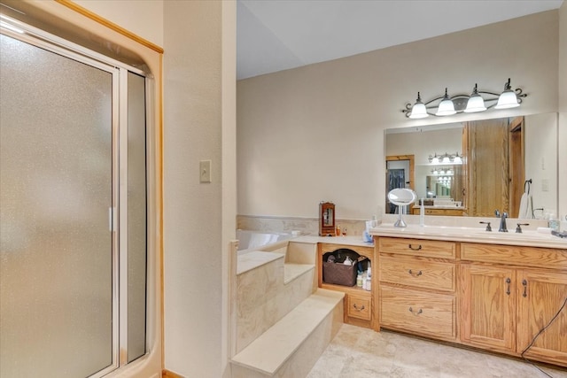 bathroom with vanity with extensive cabinet space, tile floors, and plus walk in shower