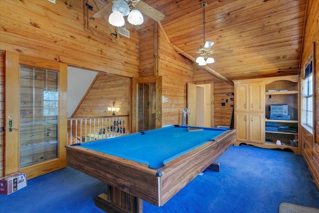 rec room featuring wooden walls, dark colored carpet, ceiling fan, and billiards