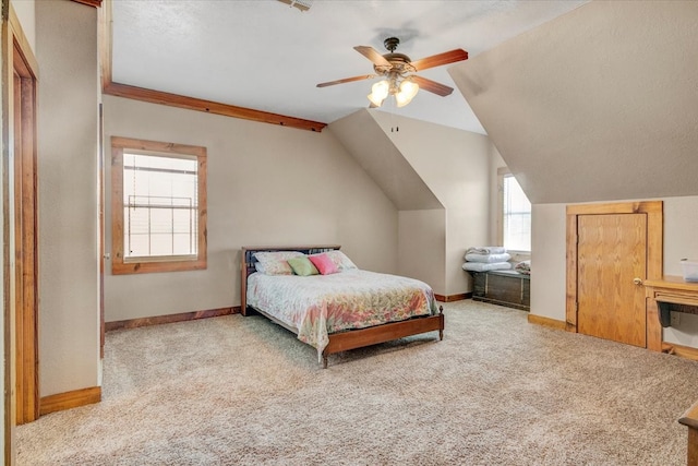 carpeted bedroom featuring ceiling fan and vaulted ceiling