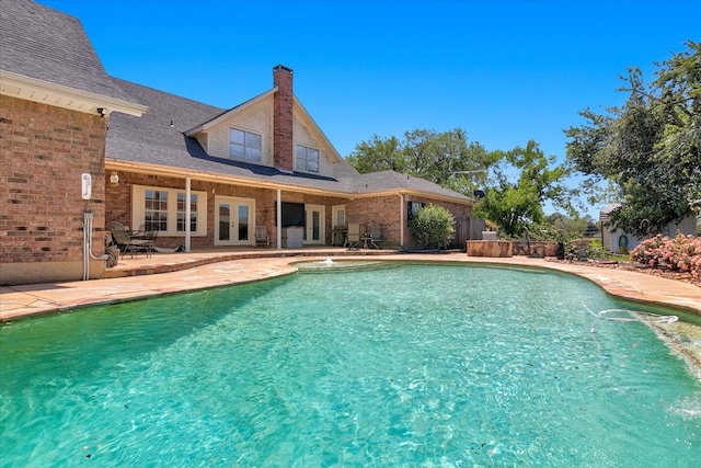 view of pool featuring a patio