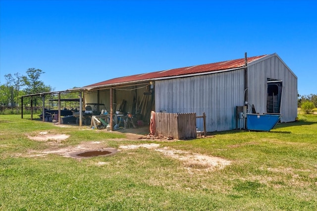 exterior space featuring a yard and an outdoor structure