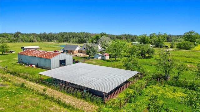 birds eye view of property with a rural view