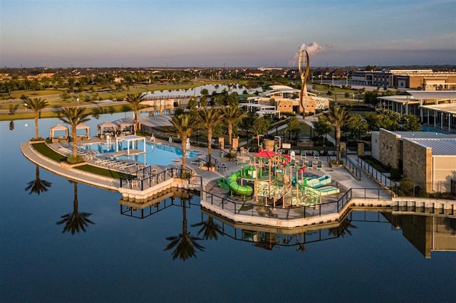 aerial view at dusk with a water view