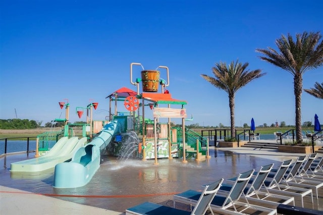 view of jungle gym featuring a water view