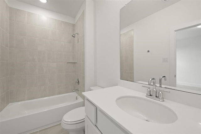 full bathroom featuring vanity, toilet, and tiled shower / bath combo