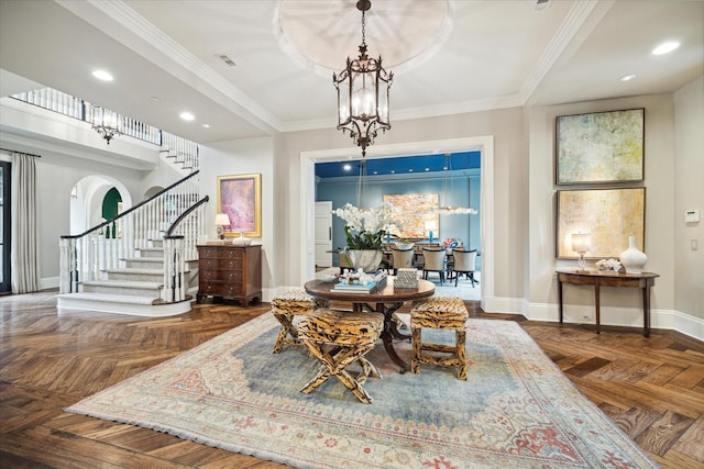 dining area featuring dark parquet floors, crown molding, and a notable chandelier