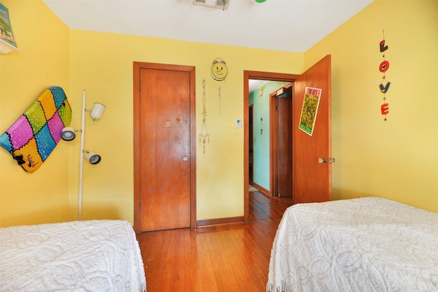 bedroom featuring wood-type flooring