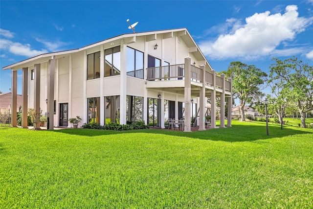 back of house featuring a yard and a patio