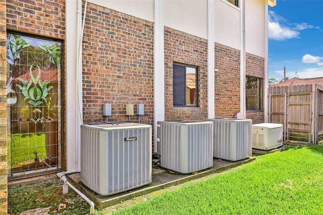 view of side of property featuring central air condition unit