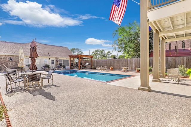 view of swimming pool with a pergola, a fenced in pool, a patio, and fence