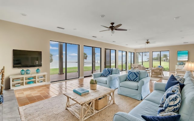 tiled living room featuring ceiling fan