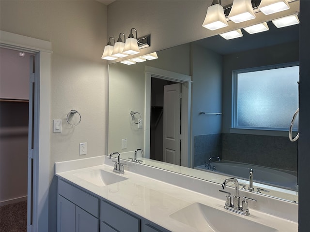 bathroom with vanity and a bath