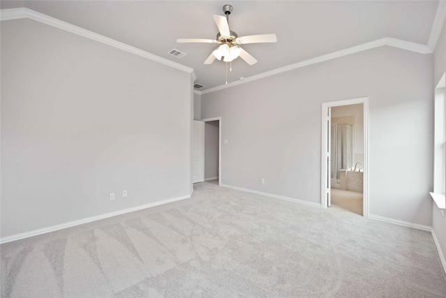 unfurnished bedroom with ceiling fan, ensuite bathroom, light carpet, and ornamental molding