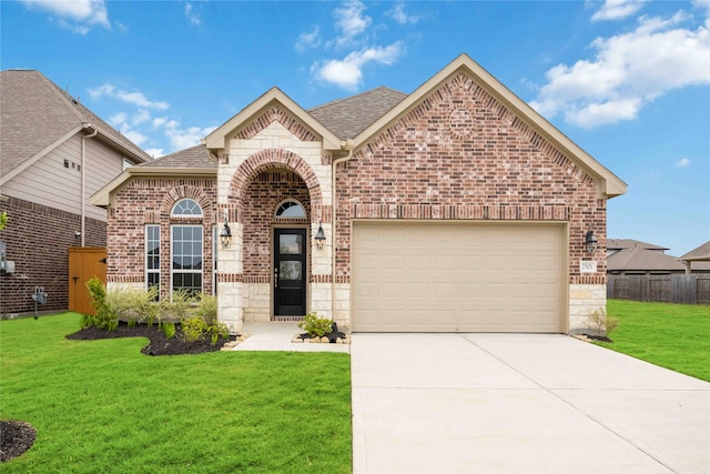 front facade with a front lawn and a garage