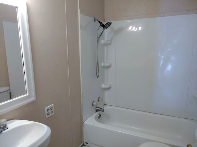 full bathroom with sink, shower / bath combination, and toilet