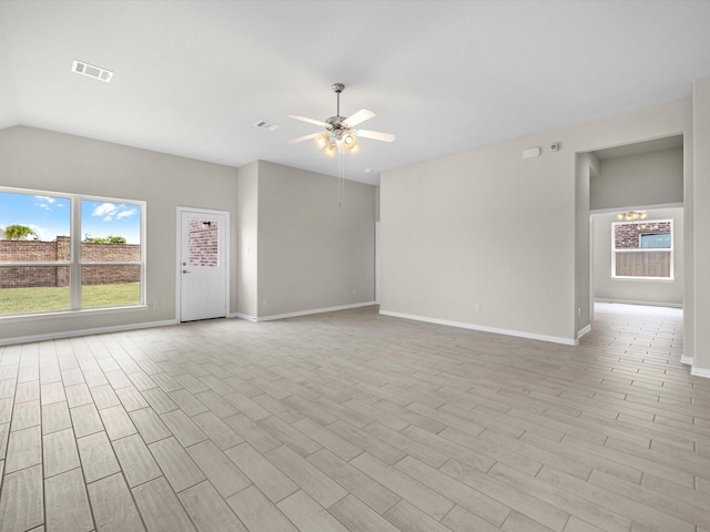 unfurnished living room with light wood-style floors, visible vents, ceiling fan, and baseboards