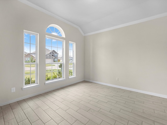 empty room with light hardwood / wood-style flooring, vaulted ceiling, and ornamental molding