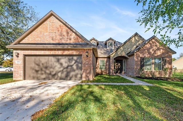 view of property featuring a front lawn and a garage