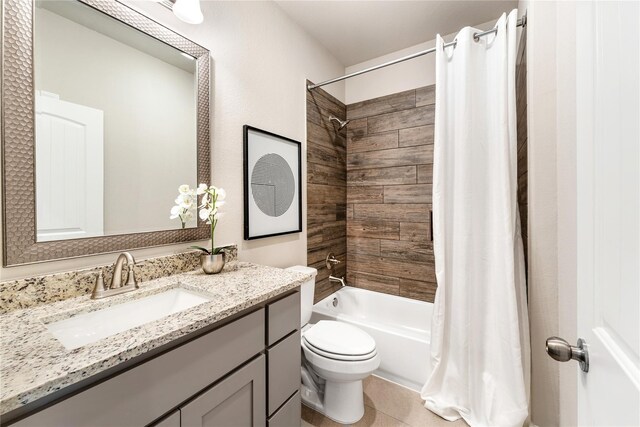 full bathroom with toilet, tile patterned flooring, shower / bathtub combination with curtain, and vanity