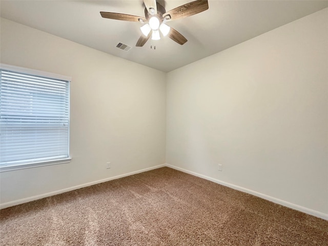 carpeted empty room with ceiling fan