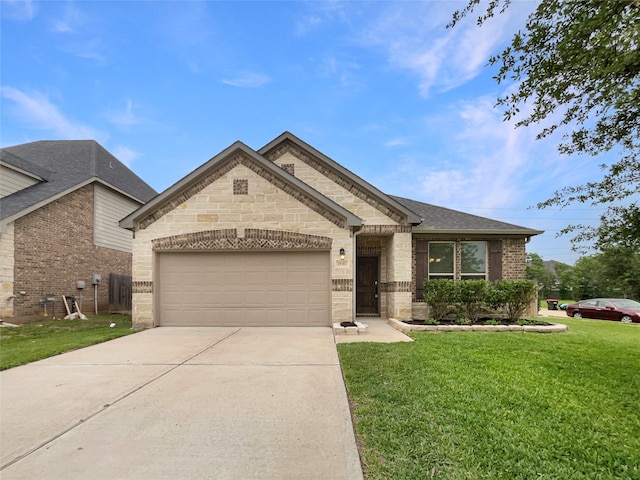 view of front of house featuring a front lawn and a garage