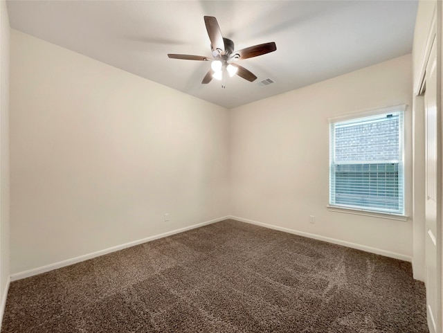 carpeted empty room featuring ceiling fan