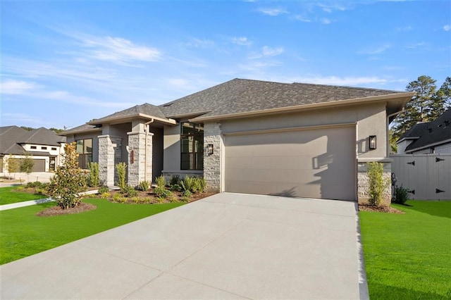 prairie-style house with a garage and a front lawn