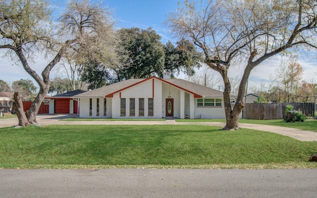 ranch-style house with a front yard and a garage