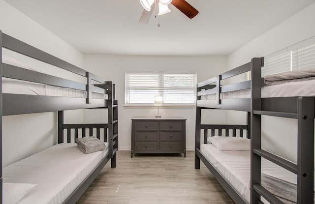 bedroom with ceiling fan and light hardwood / wood-style floors