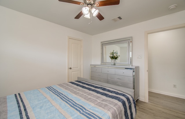 bedroom featuring ceiling fan and light hardwood / wood-style flooring