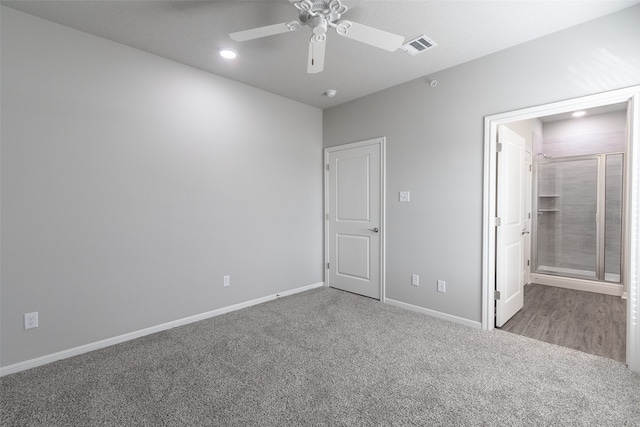 unfurnished bedroom featuring ceiling fan and carpet