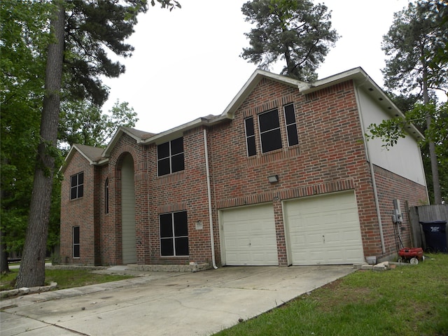 view of front of property with concrete driveway, brick siding, and an attached garage