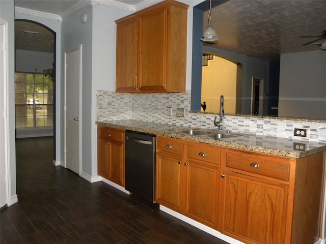 kitchen featuring sink, pendant lighting, light stone counters, decorative backsplash, and dishwasher