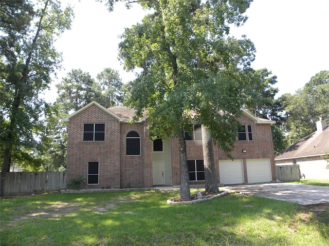 view of front of home featuring a garage and a front yard