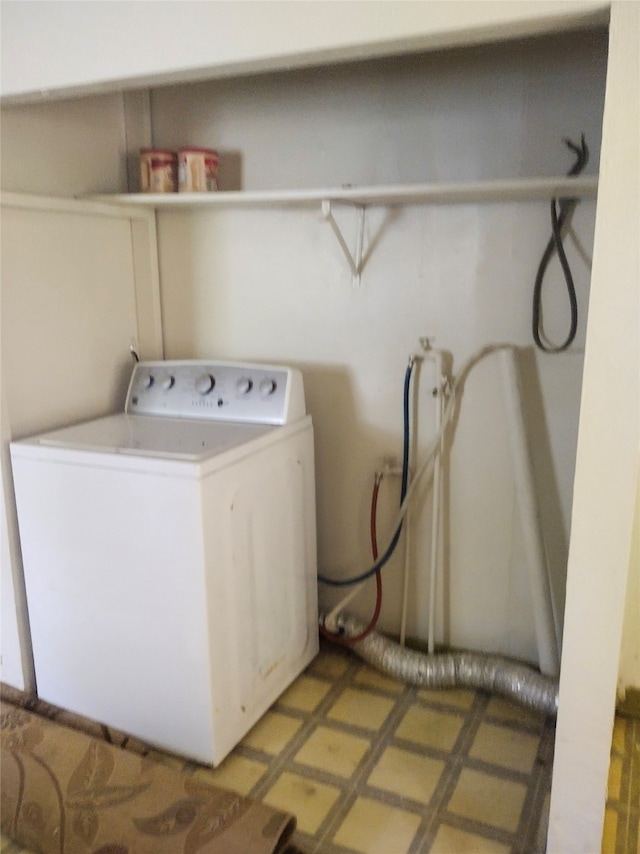 washroom with washer / dryer and tile patterned flooring