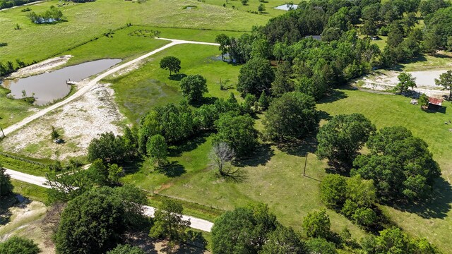 aerial view with a rural view and a water view