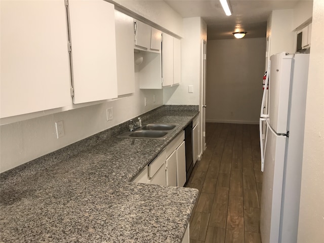 kitchen featuring dishwashing machine, dark hardwood / wood-style floors, white cabinetry, sink, and white refrigerator