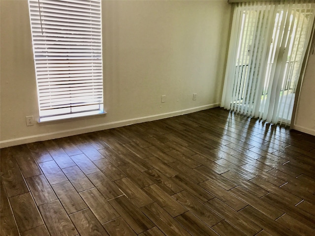 spare room featuring dark hardwood / wood-style flooring