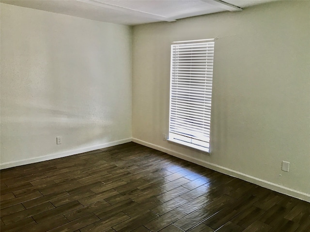 spare room featuring dark hardwood / wood-style floors