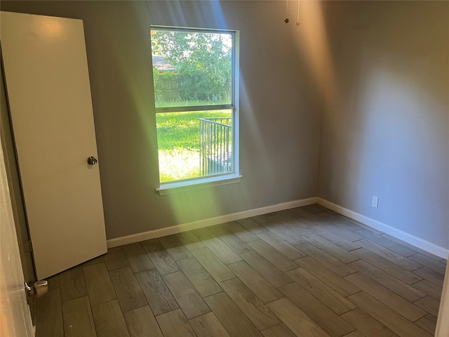 unfurnished room featuring hardwood / wood-style floors