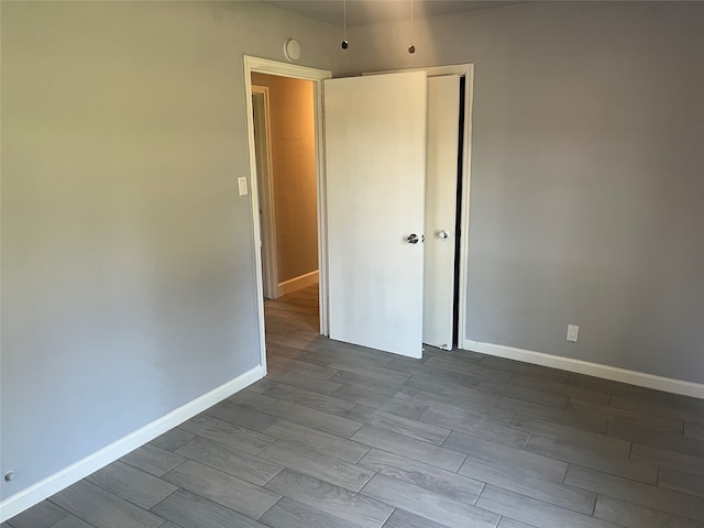 spare room featuring dark hardwood / wood-style floors